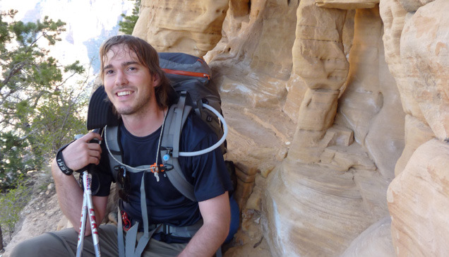 A man smiling despite a badly aching knee.